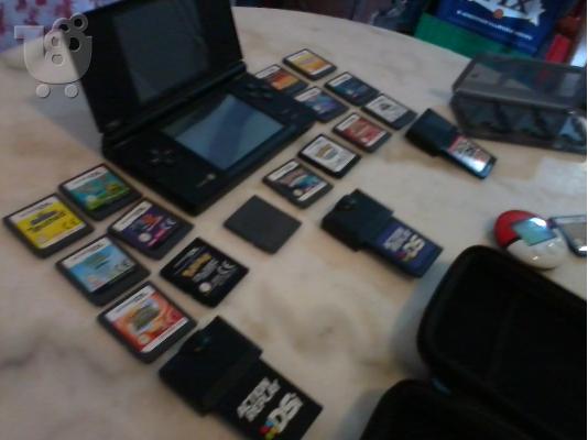 Nintendo Dsi with:Case,3 action replay,16 cards,6 card case in 150 EURW FREEEE